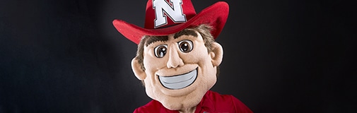 Profile view of mascot Herbie Husker